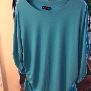 Blue top with quarter length sleeves.